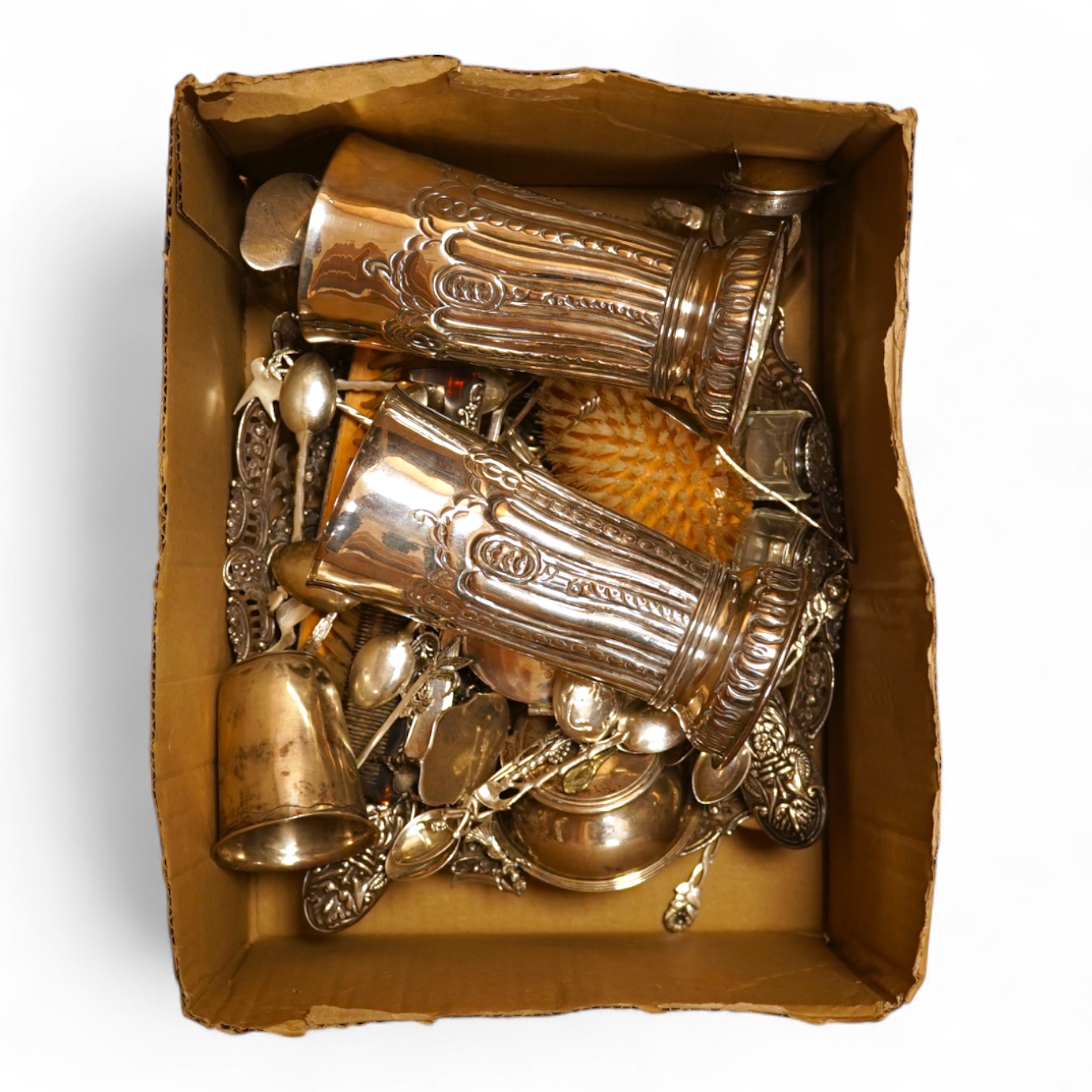A pierced 800 standard white metal fruit bowl, diameter 23.6cm, a silver mounted hand mirror and two brushes, a 19th century continental white metal pyx, a pair of George V silver mounted whisky noggins, Birmingham, 1925